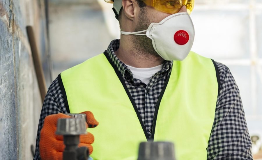 front-view-worker-with-protective-mask-hard-hat